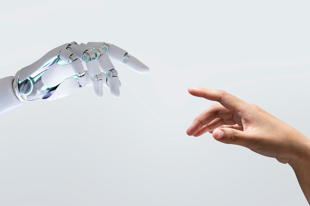 ia picture, a human hand and a rebot hand touch to illustrate the connection between the human prompt creator and the machine.